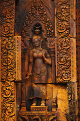 Naklejka premium Devata carving, Banteay Srei temple, Angkor, Cambodia. The citadel of women, this temple contains the finest, most intricate carvings to be found in Angkor. 967 CE