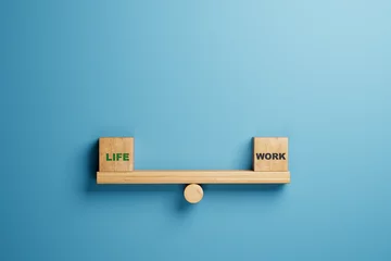 Muurstickers balance between life and work concept. life and work words balancing on wooden seesaw © Ibrahim