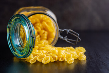 Uncooked gnocchi pasta. Raw italian pasta in jar.