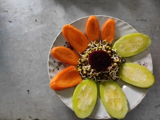 Salad with green gram sprouts, carrot and cucumber