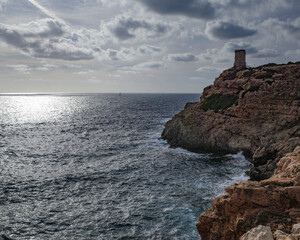 Mallorca, Spain - Oct 22, 2023: Tor de Cala Figuera and Lighthouse on the island of Mallorca