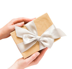 Women's hands hold gift box with satin ribbon in PNG isolated on transparent background