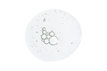 A drop of body serum or cosmetic oil with bubbles. Liquid skin care product. Isolated on a white background.