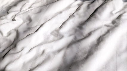 Close-up. Selective focus of unmade white soft linen on the bed