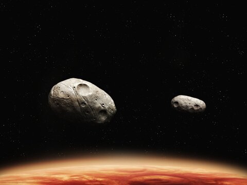 Phobos and Deimos, moons of the red planet. Asteroids satellites of Mars against the background of space.