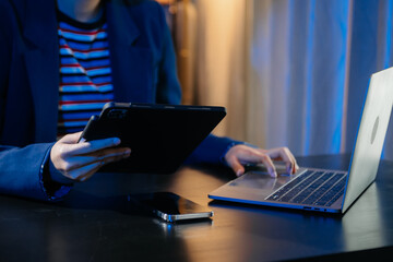 Businesswoman hand using smart phone laptop and tablet with social network
