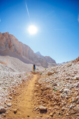 Obraz premium child travels in the mountains with a backpack. mountain hike in high mountains. Turkey.