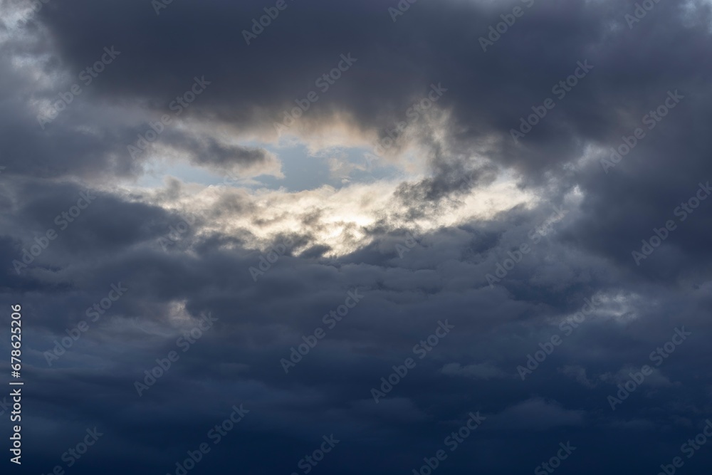 Wall mural image of dark clouds in the sky