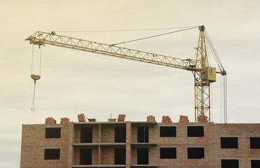 View of a large construction site with buildings under construction and multi-storey residential...
