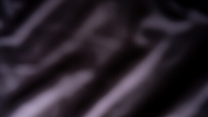 The background image is blurred, grey-black, with gradients, and brightness, with an uneven texture