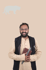 Obraz premium Male Indian teacher giving expression in class room.