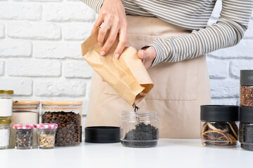 woman Reusing Glass Jars To Store Dried Food Living Sustainable Lifestyle At Home