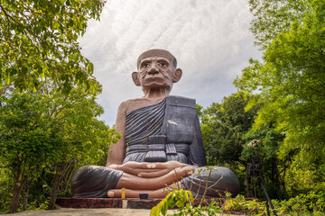 A Buddhist Statue at the Thai Island Koh Larn near Pattaya District Chonburi Southeast Asia - obrazy, fototapety, plakaty