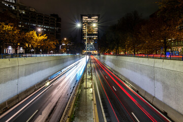 Fototapeta na wymiar The Hague, Netherlands Traffic streaks on a sunken highway, Utrechtsebaan, at night.