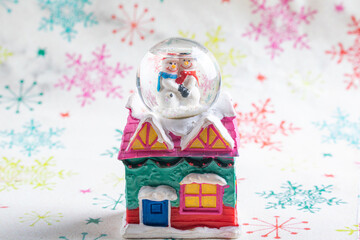 Christmas ornaments, beautiful Christmas decorations on light surface with snowflake designs, selective focus