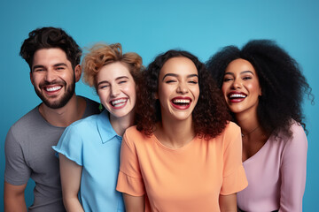 Cheerful young diverse people smiling and looking at camera on blue background.