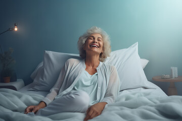 Happy fresh beautiful senior woman waking up after healthy sleep in cozy comfortable bed.
