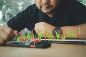 Serious man trader analyst looking at phone monitor, investor broker analyzing indexes, financial...