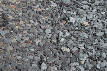 The background image is a dark stone. Many small and large lumps gathered together. Looks natural...