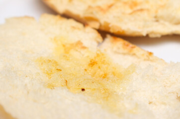 close up of bread. close up of a slice of bread. texture of bread with melted butter. bread with selective focus. food details.