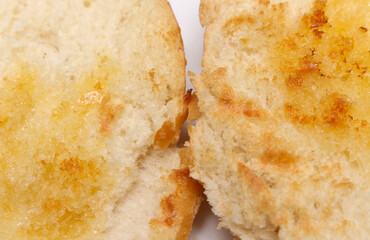 close up of bread. close up of a slice of bread. texture of bread with melted butter. bread with selective focus. food details.