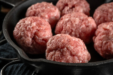 Fresh raw pork meatballs with spices