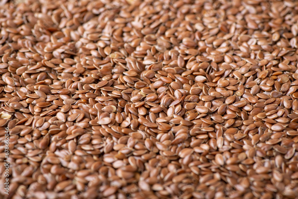 Wall mural Background of flax grain. Close up of harvested dried linen seed