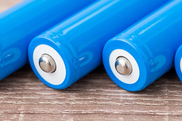 Close up of positive contact of rechargeable li-ion batteries. New high capacity batteries on the...