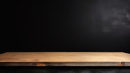 Empty wooden table top on black dark concrete wall