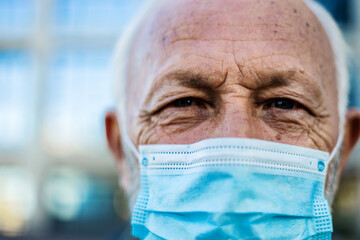 Covid, face mask and mature man eyes or portrait for healthcare safety, compliance and wellness...