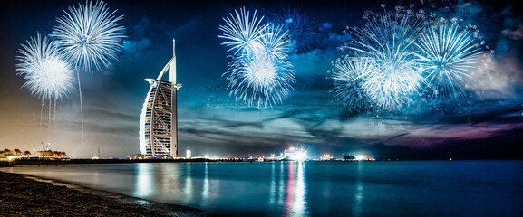 fireworks around Burj Al Arab - exotic New Year destination, Dubai, UAE - obrazy, fototapety, plakaty