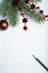 empty notebook page and fir branch New Year goals