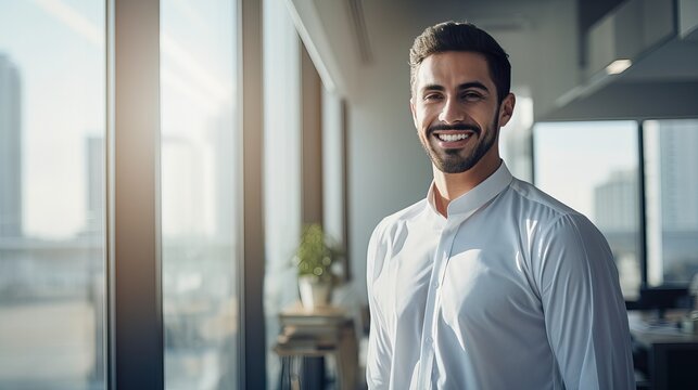 Smiling Arab Young Man in Modern White Office