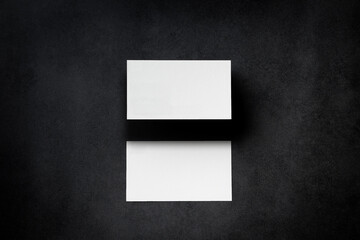 blank mockup template empty white clean square business card and postcard carte to display on desktop tabletop textured black background with shadow