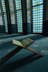 Islamic vertical background photo. The Holy Quran on the lectern in a mosque