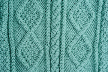 Turquoise Knitted woolen background. Textured, Patterned