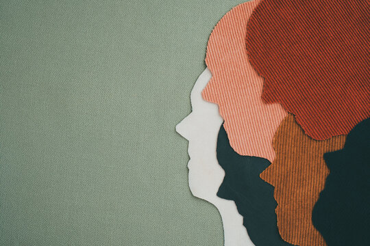 Silhouette profile of people made of cloth on a green background. Anti-racism, international tolerance, humanity, Multicultural diverse, equality concept. Space for text