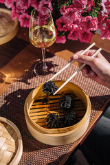 asian dumplings with cuttlefish ink top view