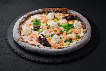 black pizza with shrimp and cream
