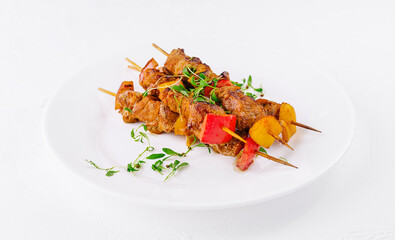 Chicken skewers with slices of sweet peppers