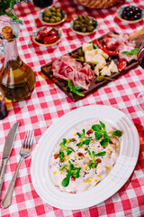 salad with seafood and Italian antipasti