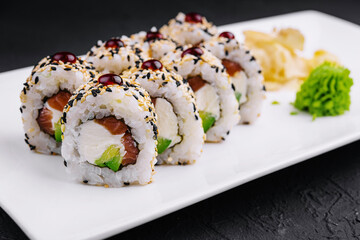 sushi rolls with raw tuna and avocado sprinkled with sesame
