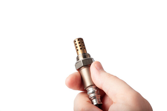 Oxygen sensor for gasoline and diesel engines in the hand isolated on white. lambda probe is reliable component to optimize your car's performance