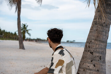 Man Relaxing on Miami Beach with Ocean View