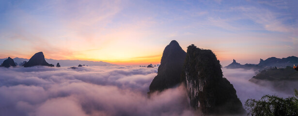 Sunrise time over the Karst mountain natural landscape from Xianggong Mountain, with rolling clouds...