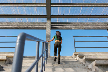 Fototapeta premium Step by Step: Athletic Stairwell Ascent