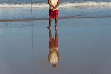 Fisherman is seen on the edge of Jaguaribe beach in the city of Salvador, Bahia.