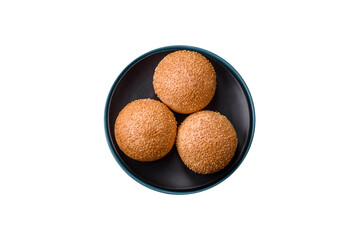 Delicious fresh crispy white round bread with seeds and grains