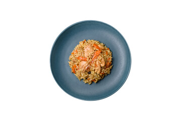 Delicious Uzbek pilaf with chicken, carrots, barberry, spices and herbs