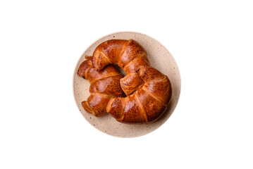 Delicious baked crispy croissants as an element of an invigorating, nutritious breakfast